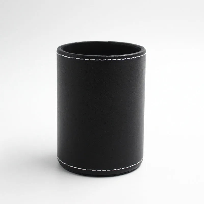 Round black leather pen holder container showing cylindrical shape and compact dimensions
