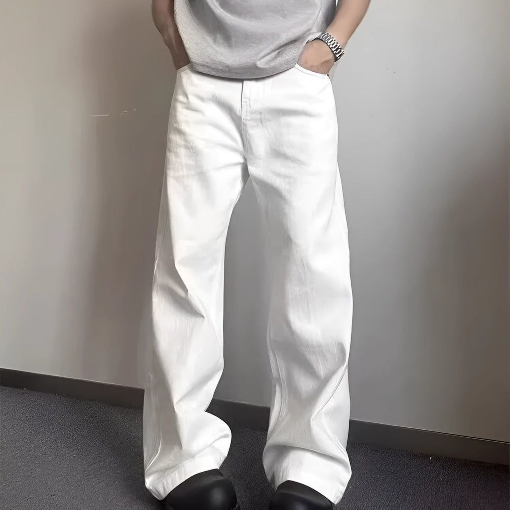 White men's straight-leg jeans with a wide loose cut on a mid waist, featuring a zipper fly.