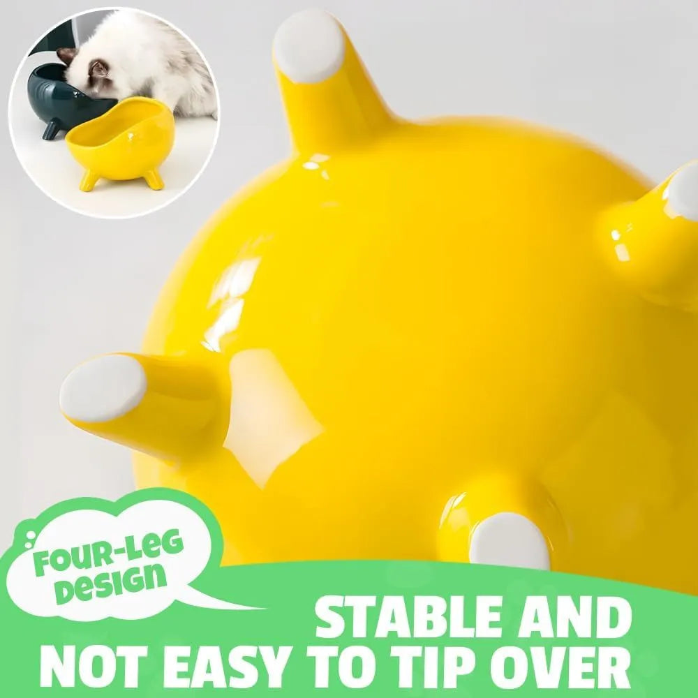 Green ceramic pet food bowl with four legs and a wide, rounded opening.