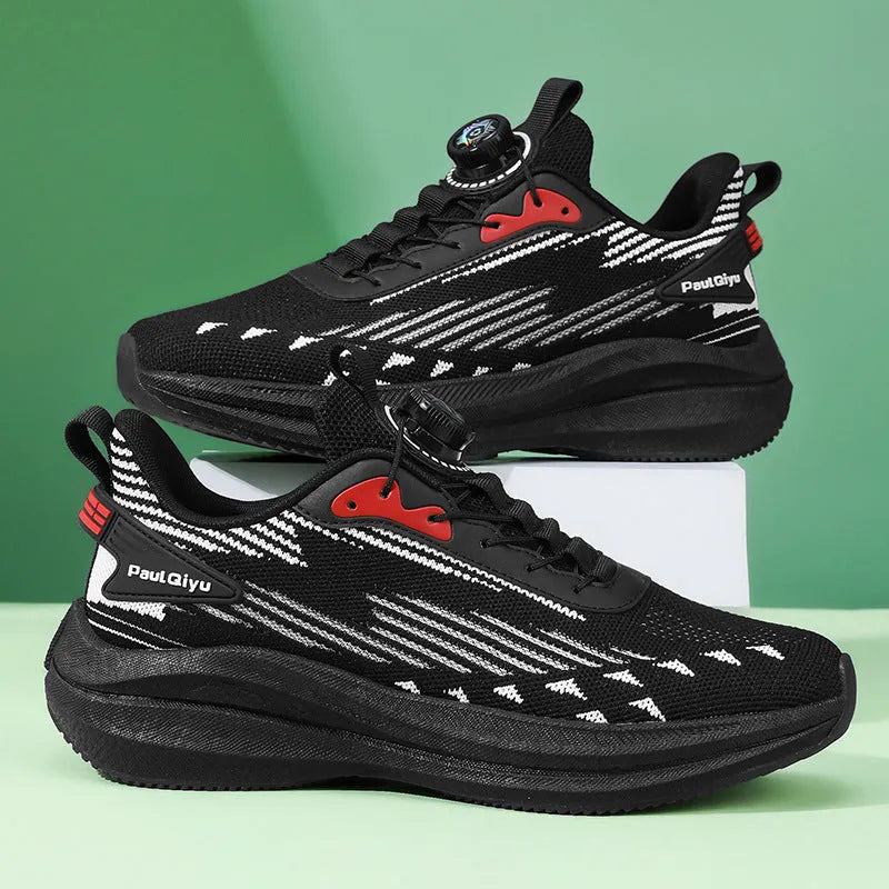 Men's black casual sports shoes with rotating buckle closure and mesh upper on a TPU sole.