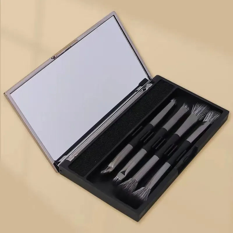 Portable makeup brush kit with mirror showing silver handle eyeshadow brushes