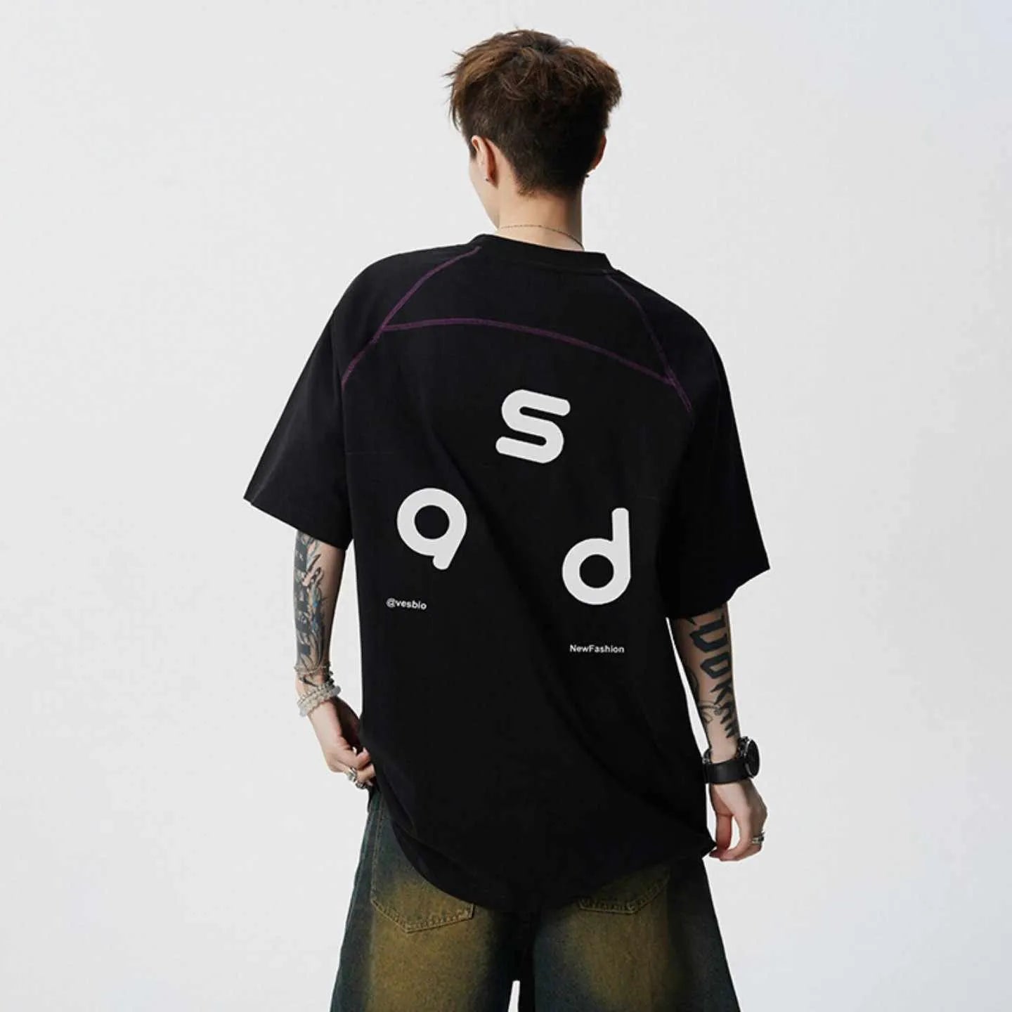Men's loose fit cotton short-sleeve T-shirt with a printed letter design, shown in available colours.
