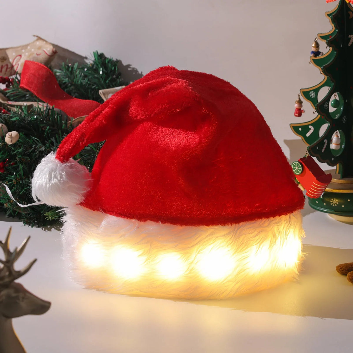 Red and white plush LED Santa hat with pom-pom and 20 multi-colour lights illuminated.