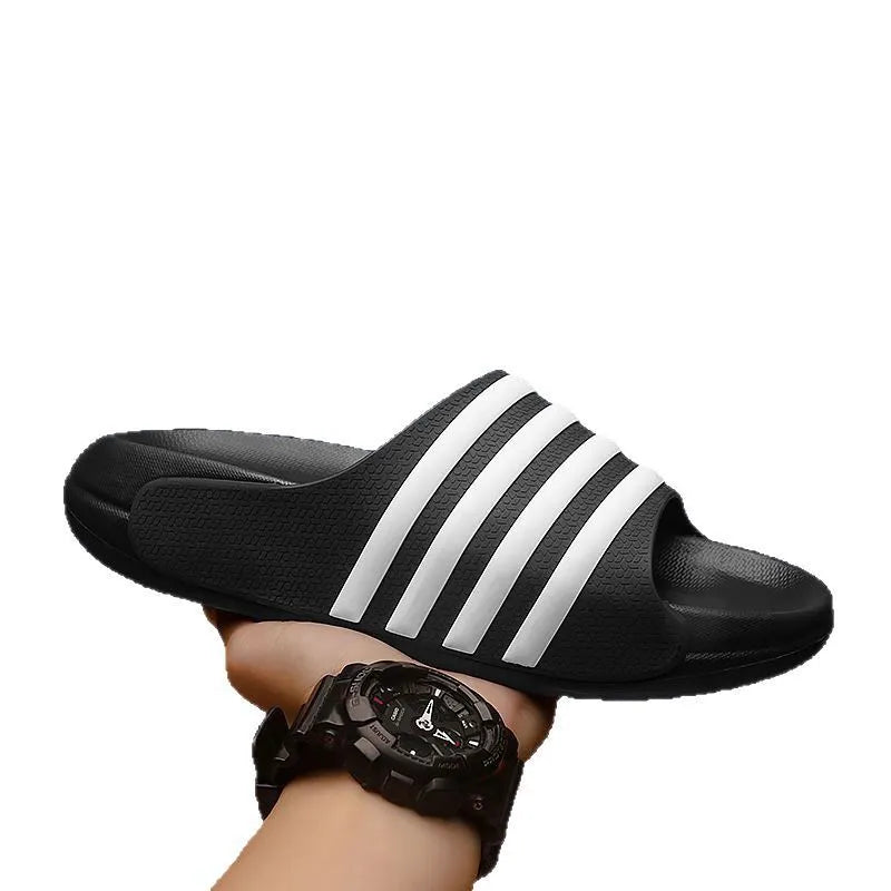 A pair of casual leisure sports style slippers with a PVC upper and EVA sole, shown in beige colour.
