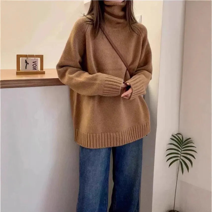 Red women's loose turtleneck sweater with a textured curling pile collar, shown in a casual setting.