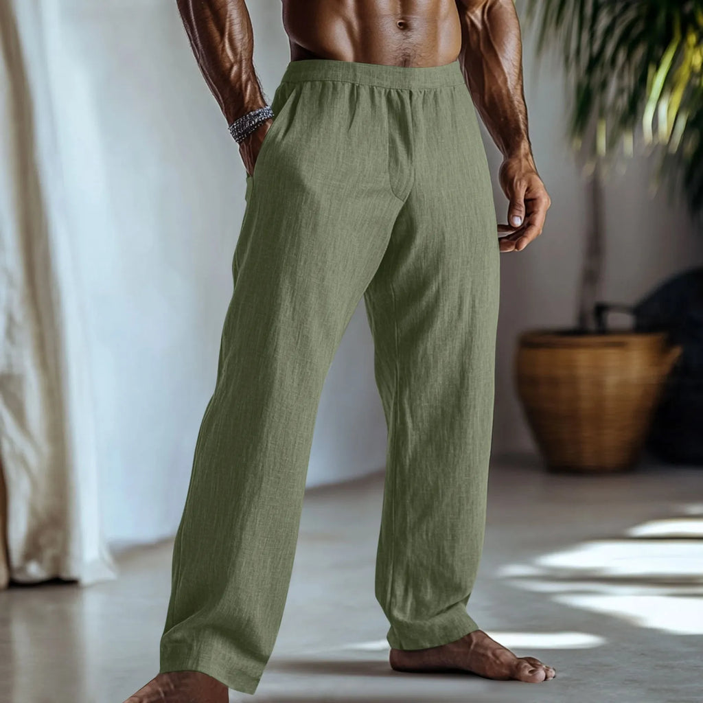 Straight leg cotton linen trousers in light green colour showing front view with pockets