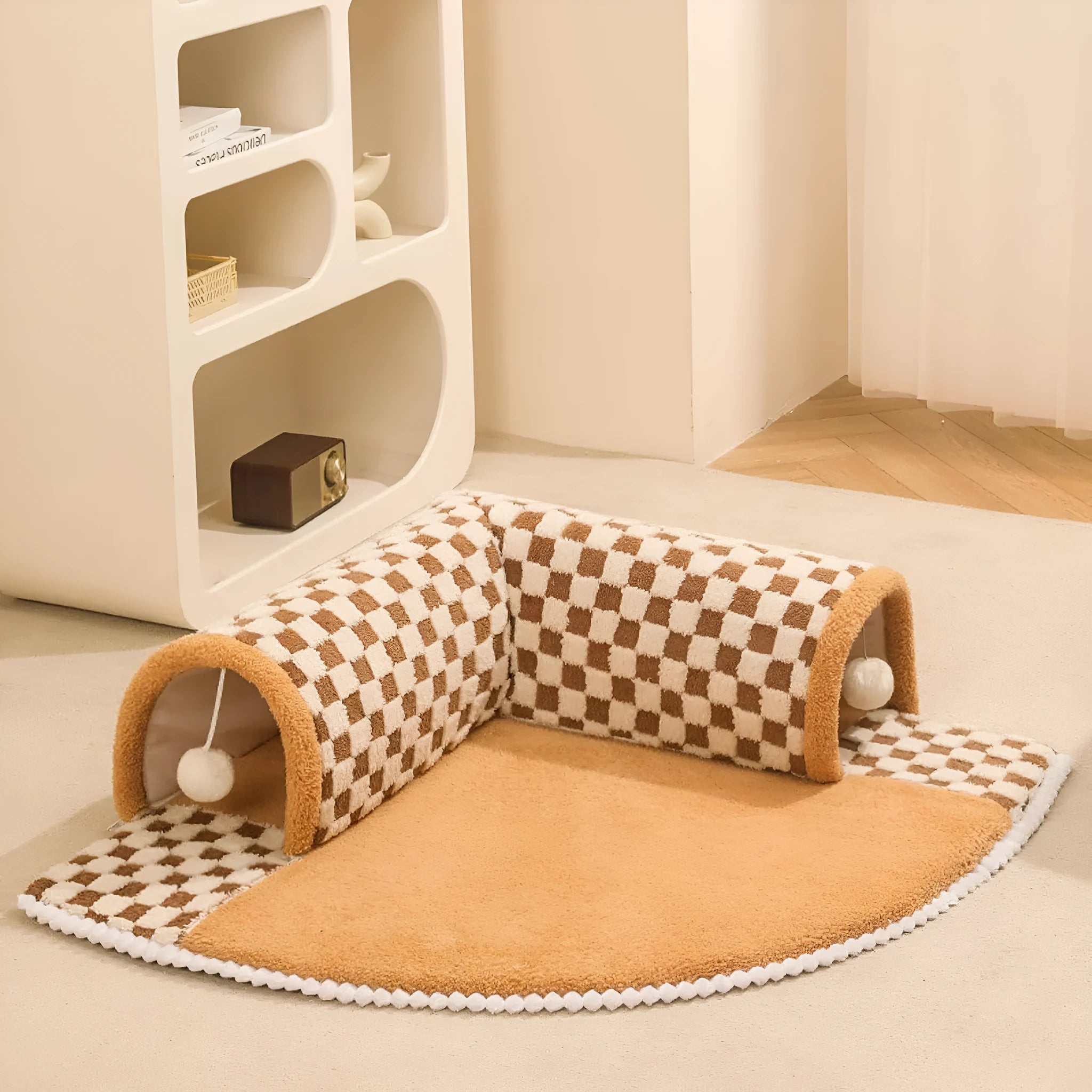 Fan-shaped plaid pet bed with integrated tunnel for dogs and cats in coffee colour, showing soft plush fabric.