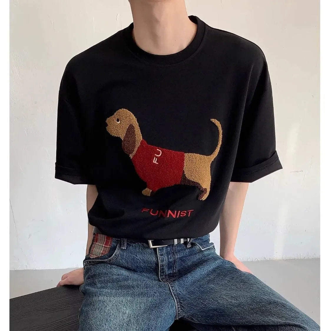 Grey men's round neck T-shirt with an embroidered dachshund dog design on the chest.