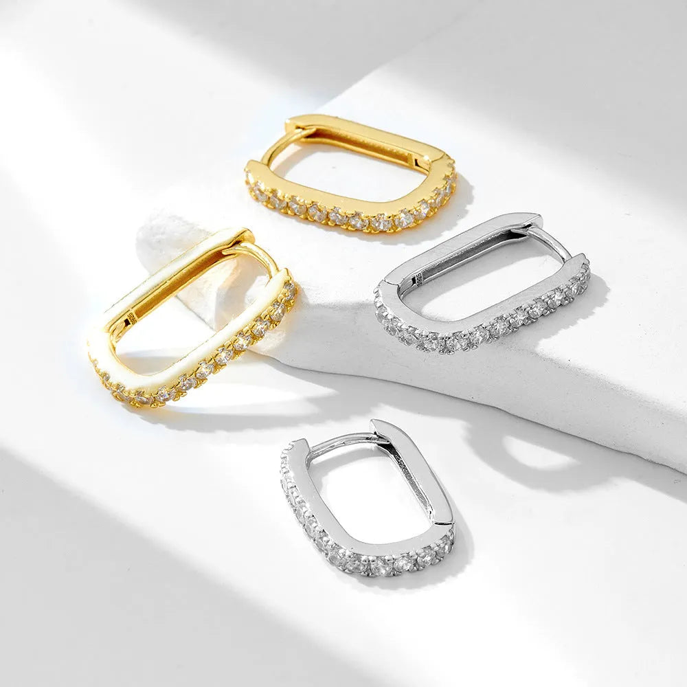 Sterling silver oval zircon ear clip earrings in yellow and white geometric design