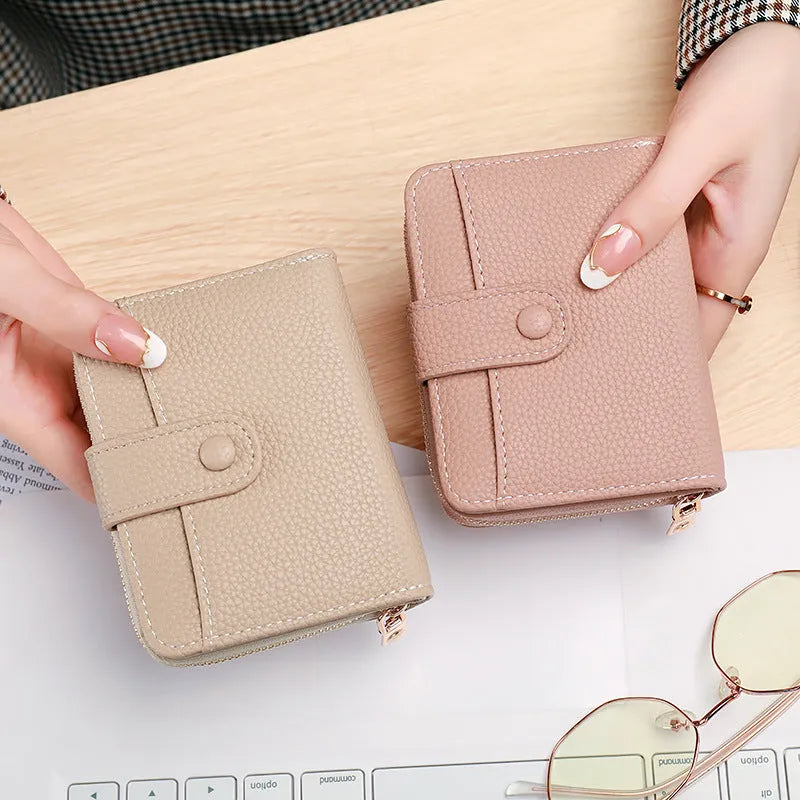 Ladies' short wallet with a lychee pattern print in a choice of beige, pink, black, or red colours