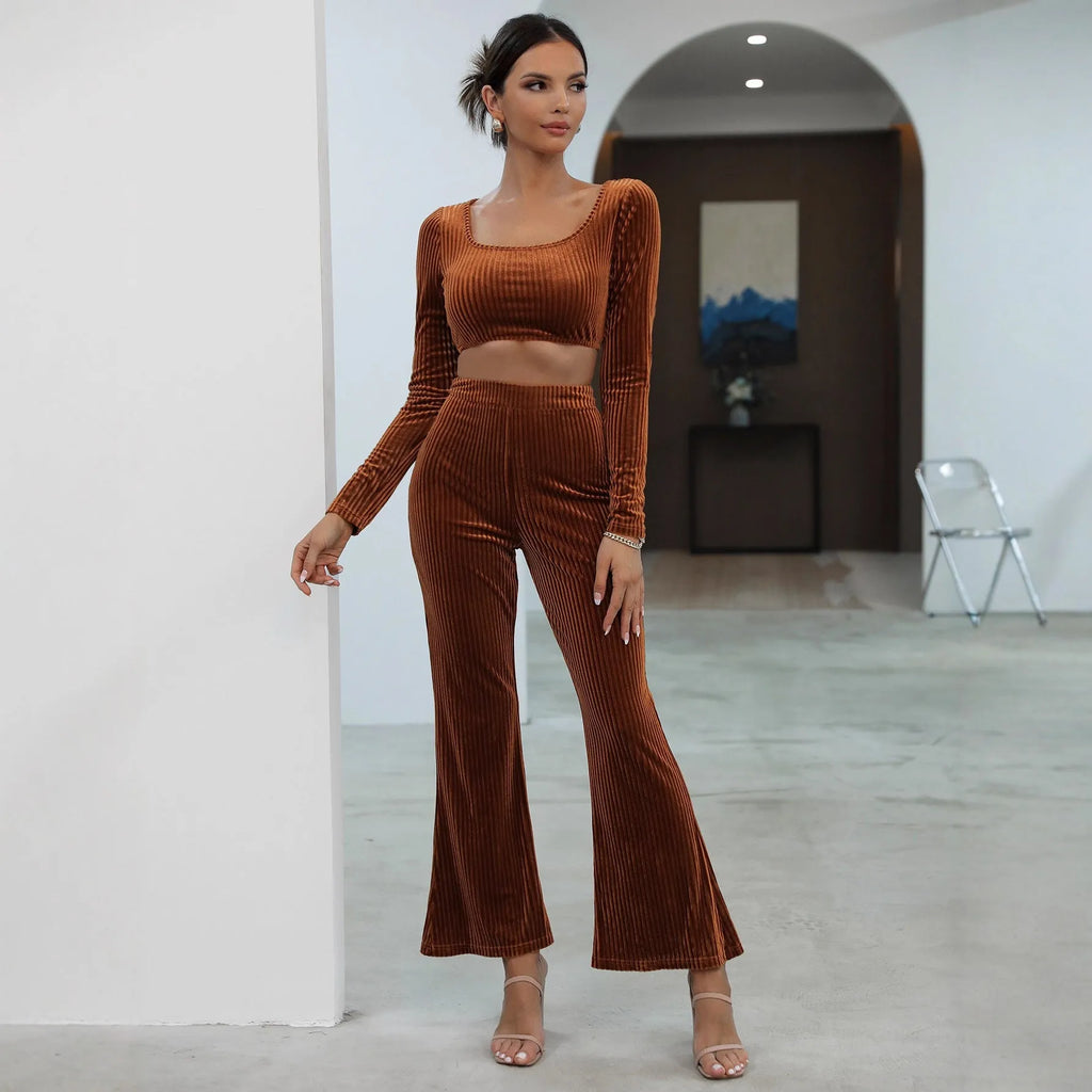 Caramel coloured women's long sleeve sweater set with matching trousers on a hanger.