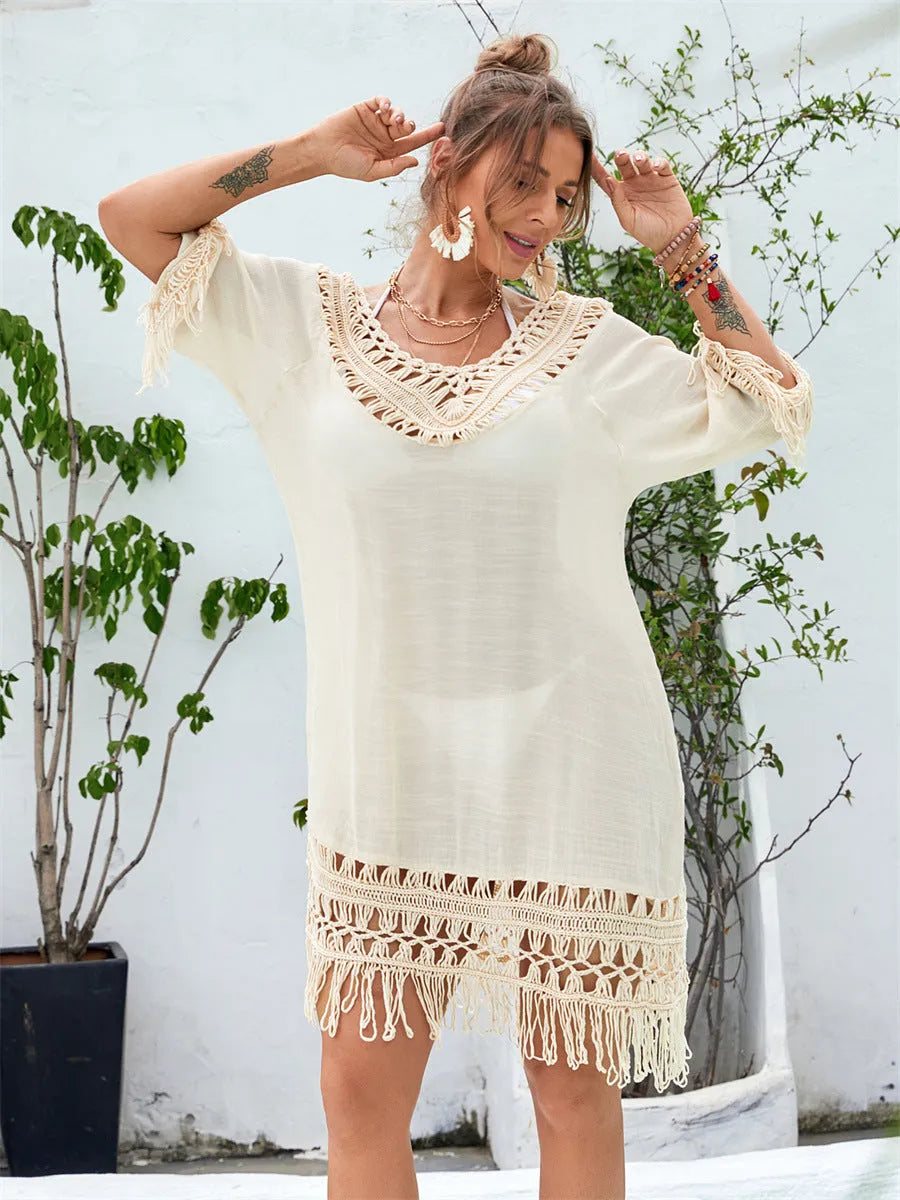 Apricot-coloured hand-crocheted beach dress for women on a mannequin.