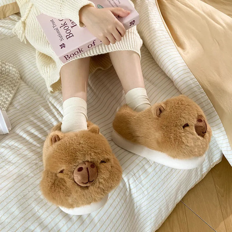 Light brown women's winter slipper boots with a cartoon pattern, cotton canvas upper, and artificial wool lining.