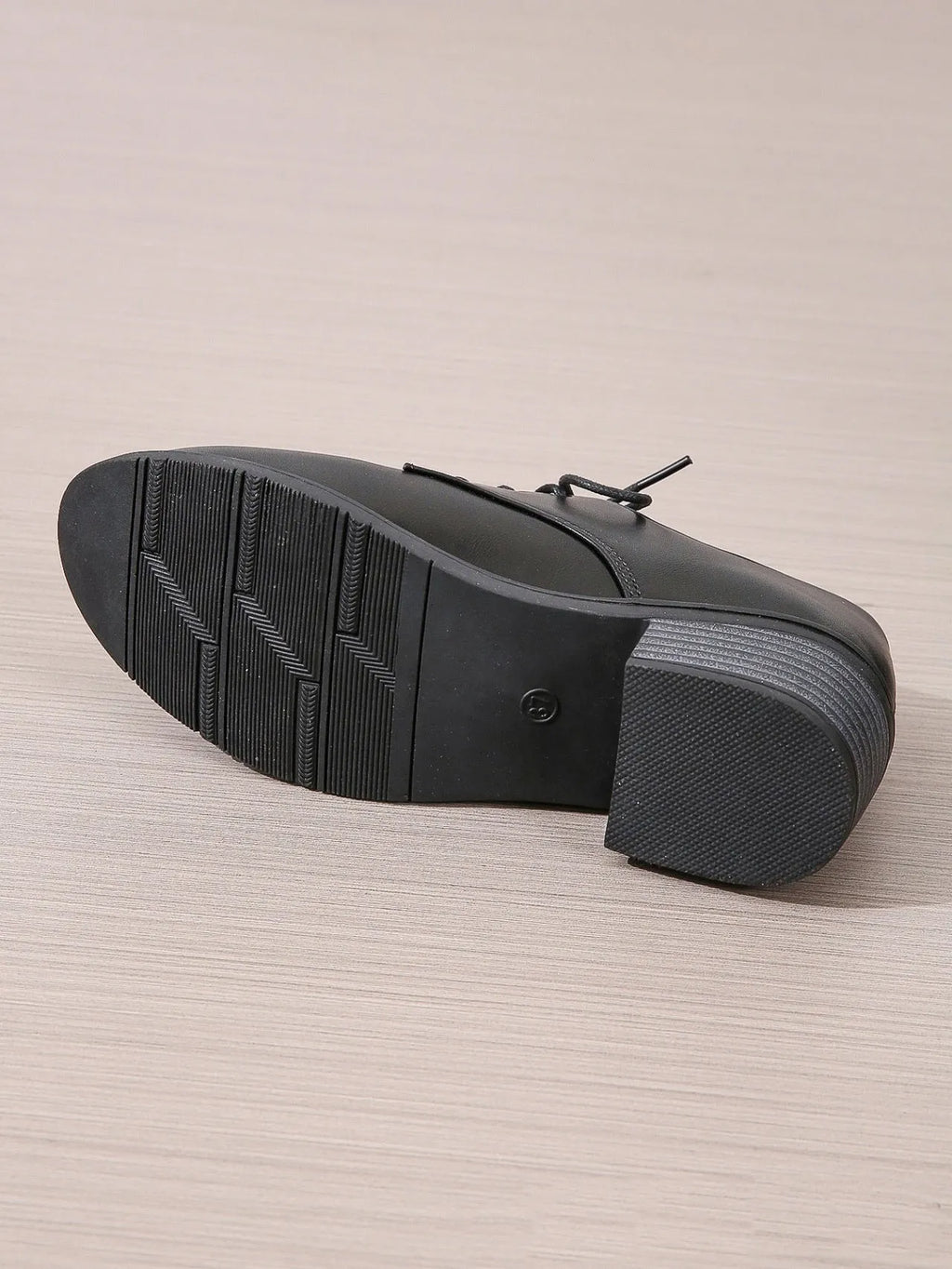Black women's low-top work shoes with a thick chunky heel and round toe.