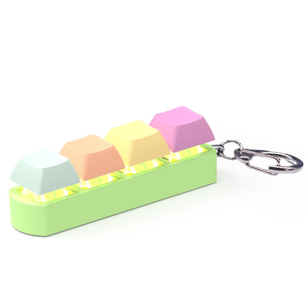 A compact mechanical keyboard switch tester with four different coloured keycaps and an included keycap puller.