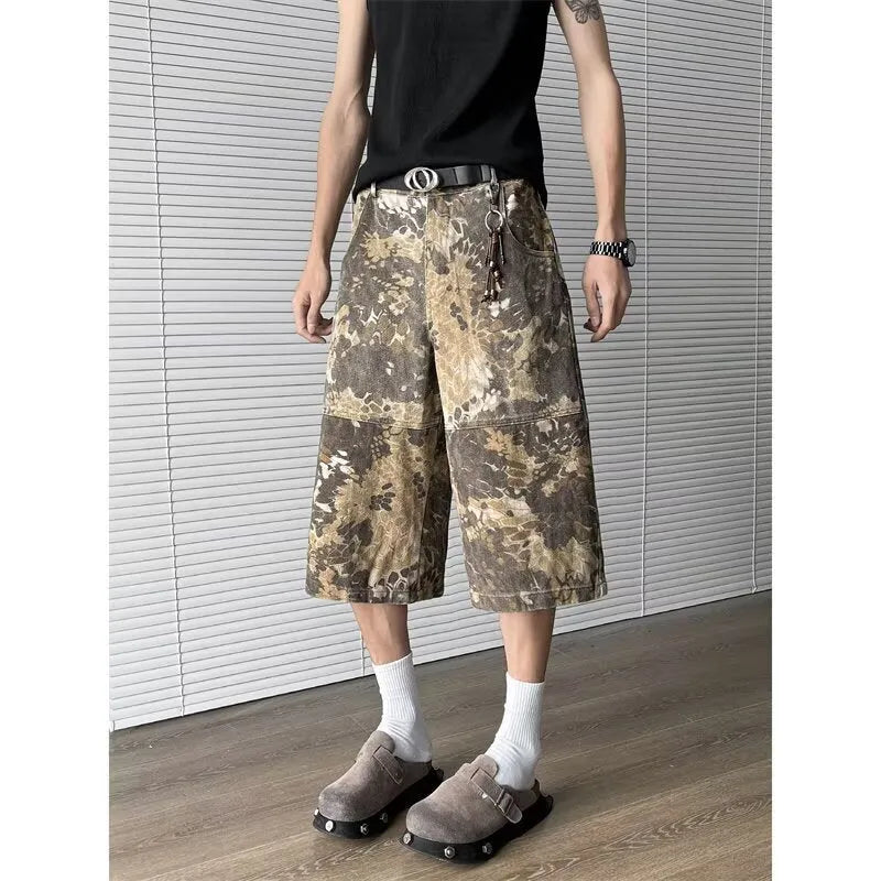 Yellow women's jeans with snake camouflage print, cropped length, and high waist.