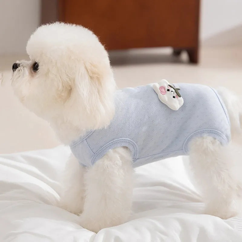 Breathable mesh pet shirt for small dogs and cats in blue or yellow with cat patch and button closure.