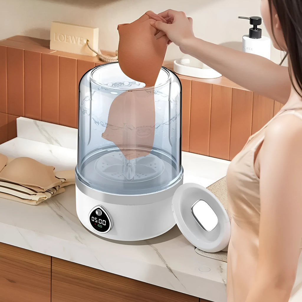 White portable mini USB washing machine on a countertop.