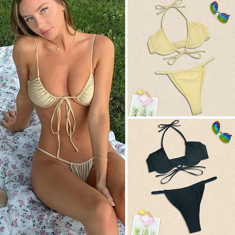 Women's black and mint green nylon two-piece bikini swimsuit set on a white background.