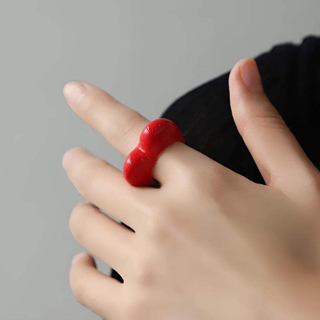 Three-dimensional heart-shaped enamel ring in a choice of colours on a zinc alloy band.