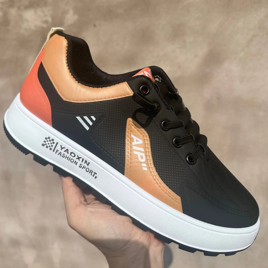 Men's casual shoes with artificial PU upper in round toe design showing breathable sports style