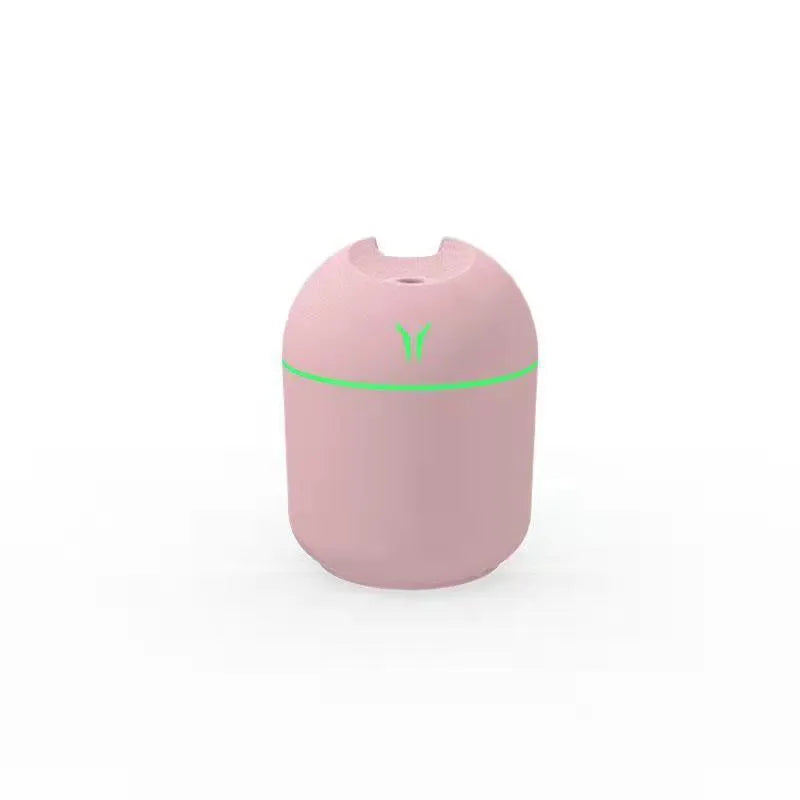 Round desktop humidifier with USB cable in ivory white, sky blue, or pink colour options