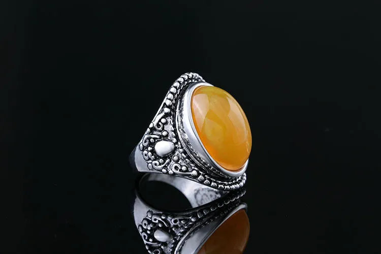 Retro geometric alloy ring with fluorescent beeswax and antique silver plating, shown in size 10.