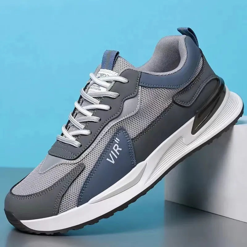 Men's colour block lace-up sneakers in grey with mesh upper and white sole.