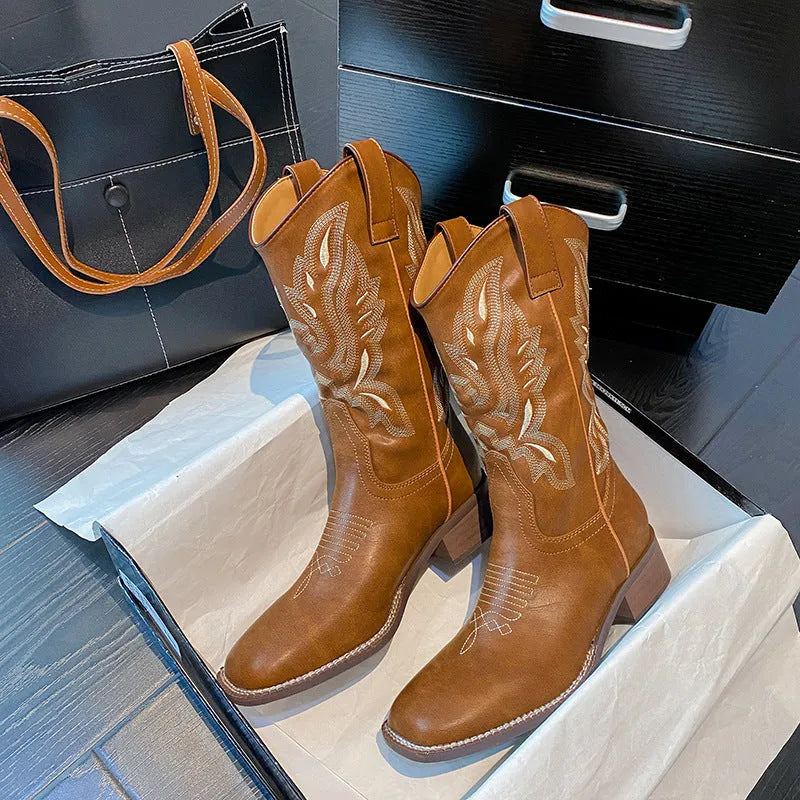 Brown women's embroidered mid-calf Martin boots with a square heel and leather lining.