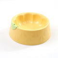 Green plastic double bowl for dog and cat food and water with anti-tip base.