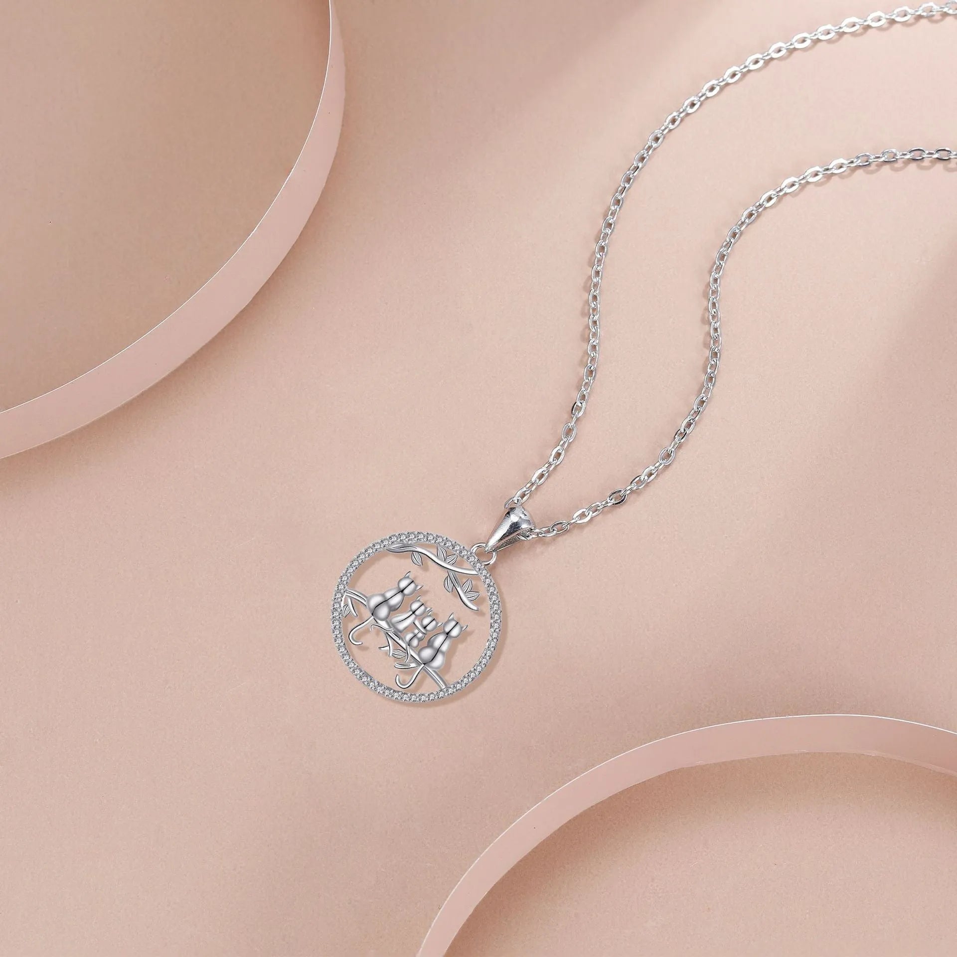 Copper Four Kitten Necklace with cat charm pendant on a cross chain for women.