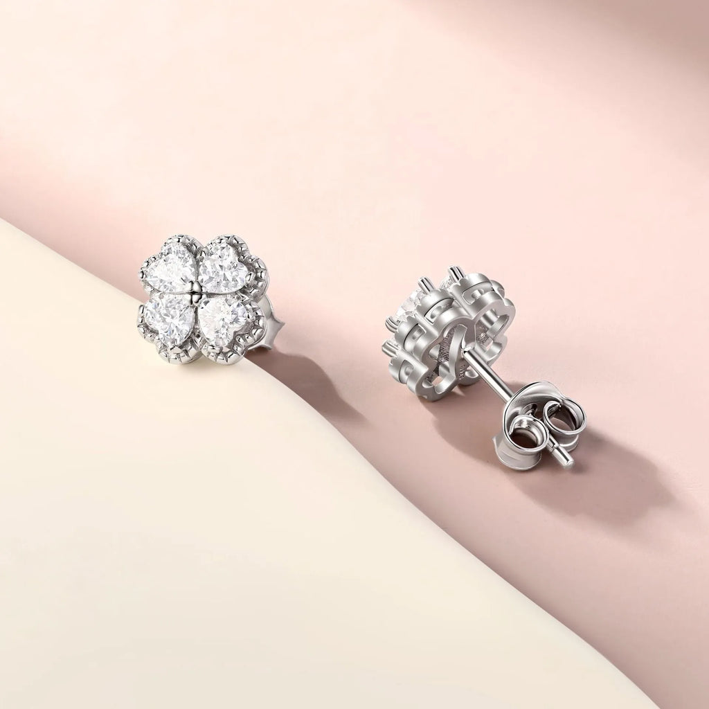 Pair of 925 silver heart-shaped earrings with inlaid zircon stones and a white gold colour finish.