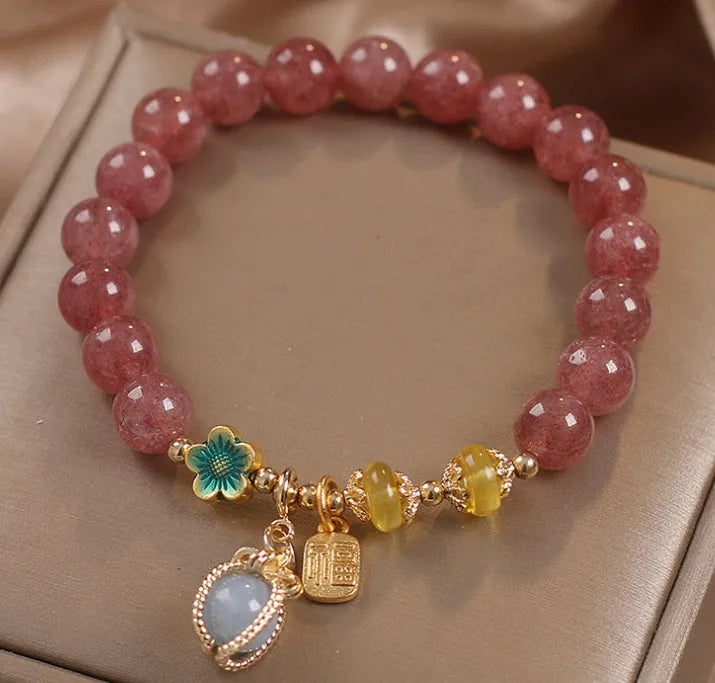 Red women's bracelet with strawberry quartz beads, alloy components, and rhinestones