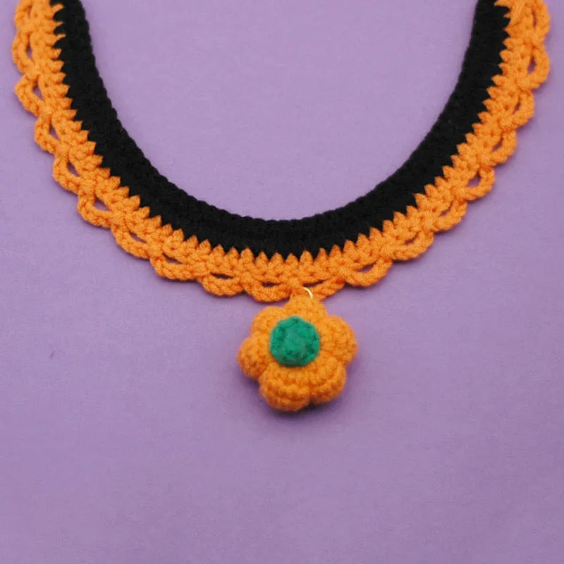 Hand-crocheted wool Halloween pet collar in pumpkin colours with adjustable sizing