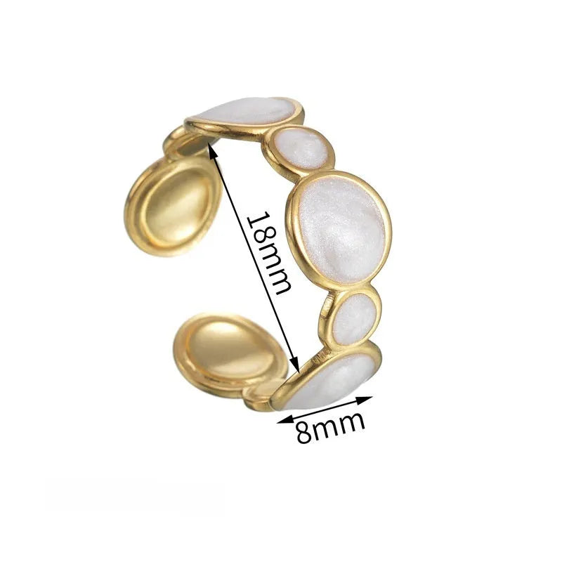 Simple stainless steel geometric ring for women with an adjustable opening.