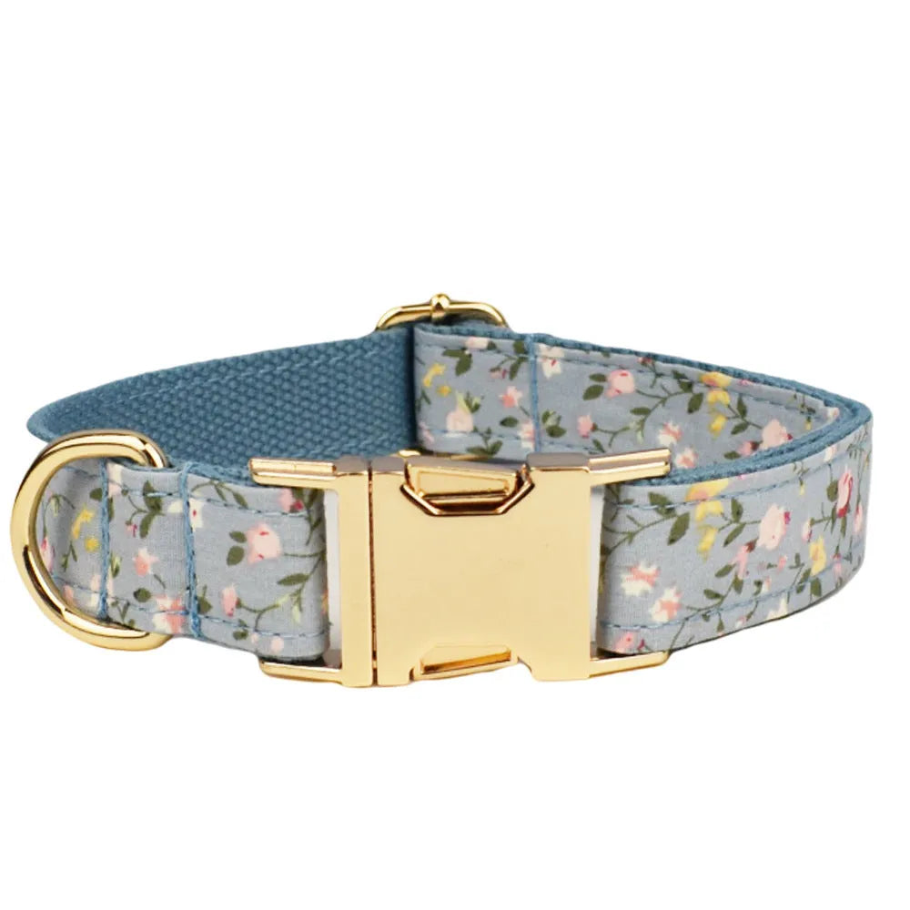 Blue floral patterned cloth dog collar with matching leash, vest, bow, and poop bag set for pet gifts