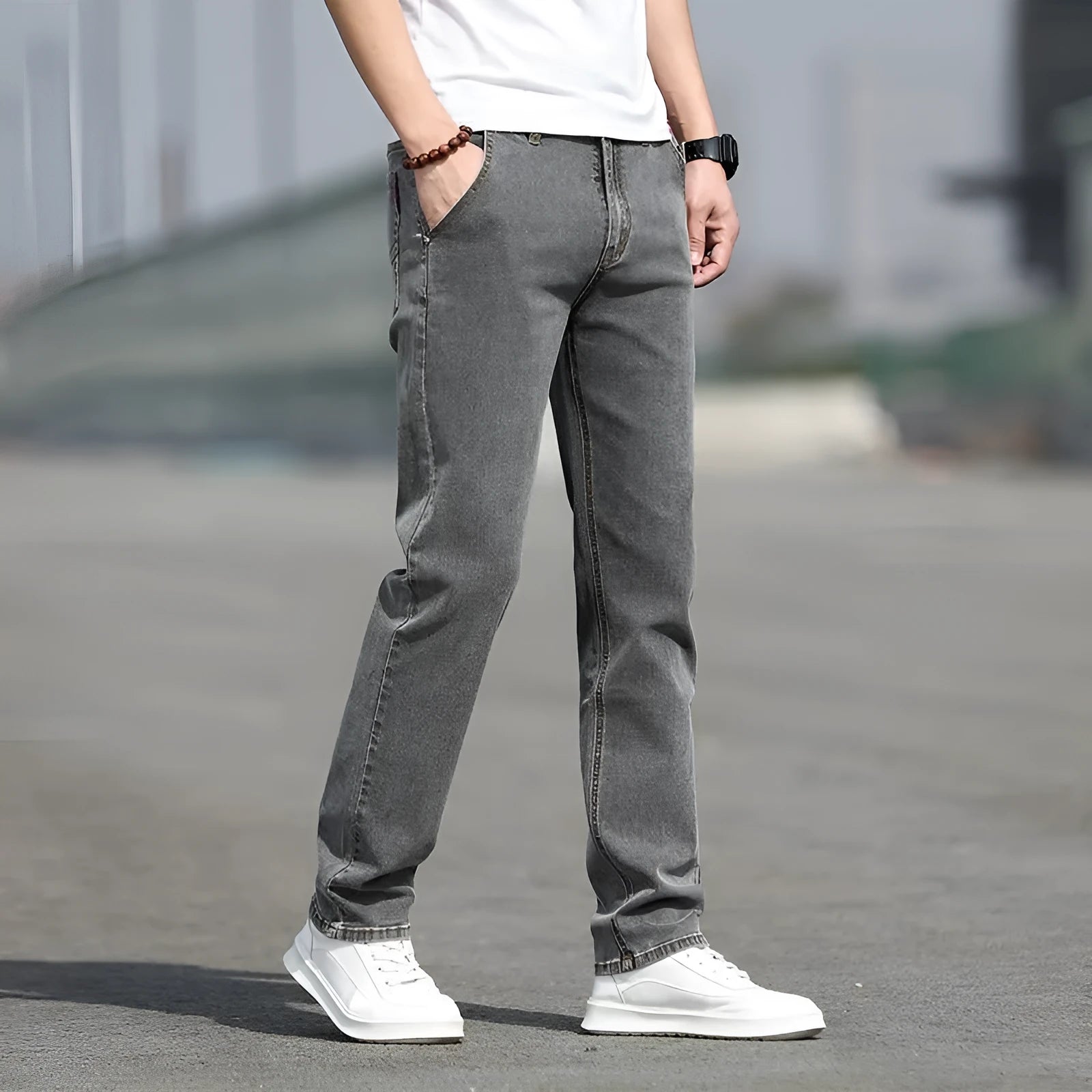 Men's smoky gray straight leg jeans with low waist and zipper fly closure