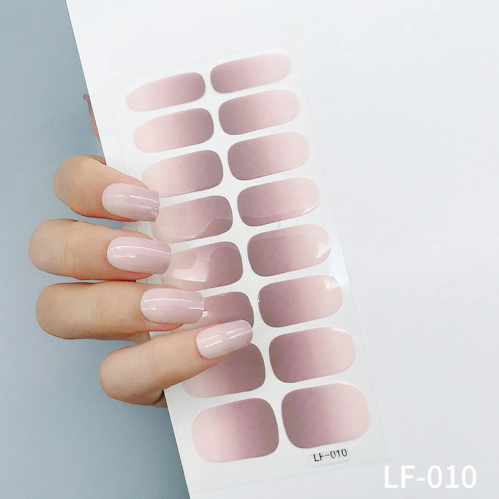 Full coverage nail art stickers sheet with 16 designs including cross, rose, tulip, and cartoon patterns.
