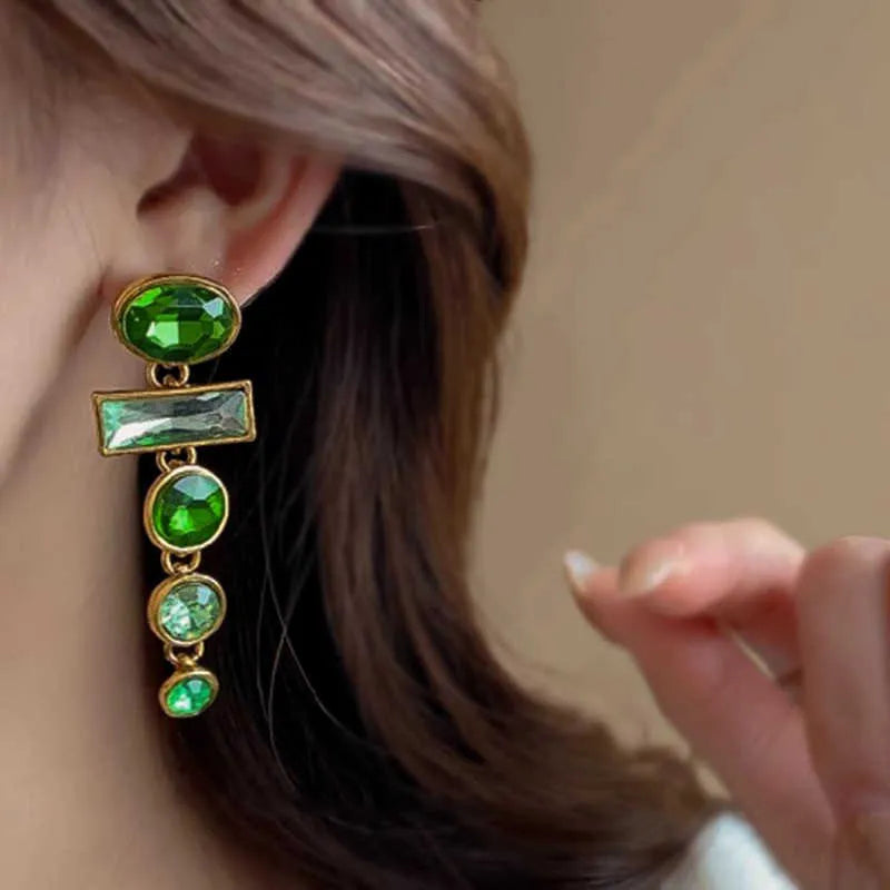 Green gradient geometric drop earrings with zircon inlays and a tassel design.