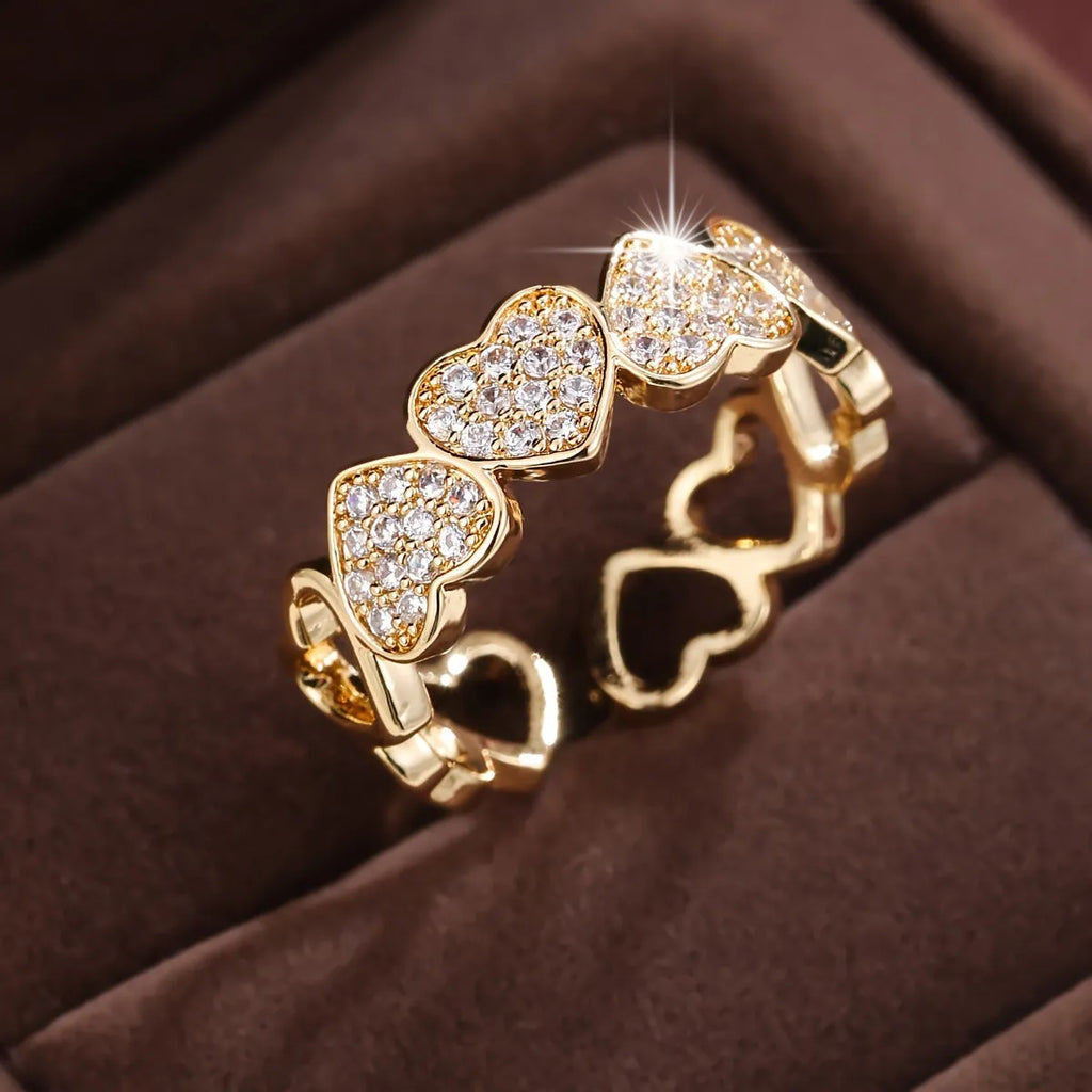 Adjustable opening couples ring with heart design in gold or silver colour on small finger