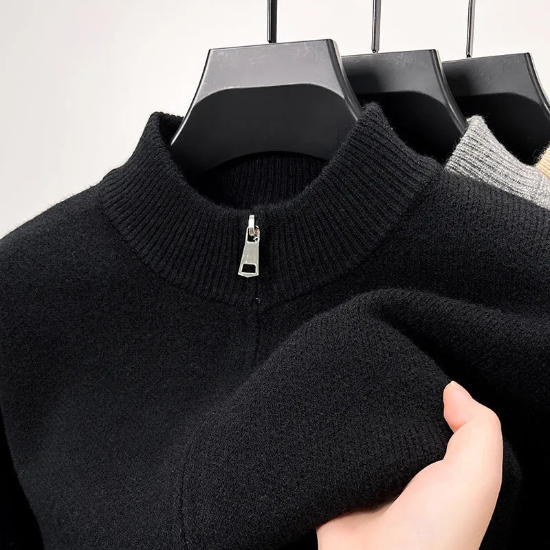 Men's black high collar zip-up knitted cardigan on a hanger, loose fit.