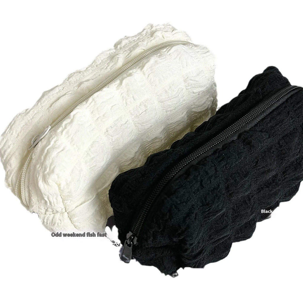 Cream puff design fabric pencil case in polyester material showing beige and black colour options