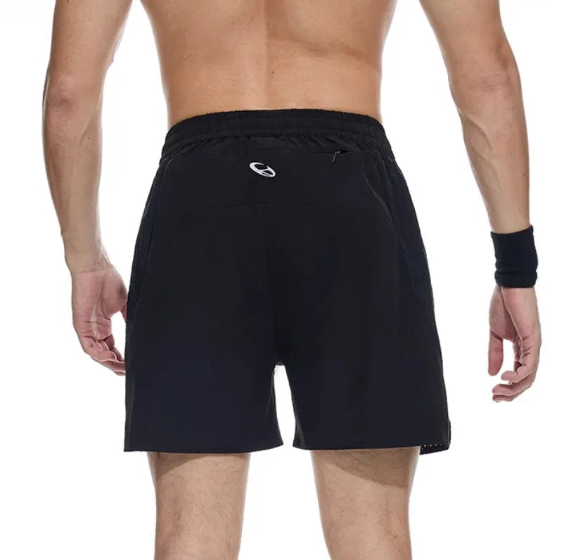 Men's black spandex running shorts with laser-stitched seams for breathability, shown in an athletic pose.