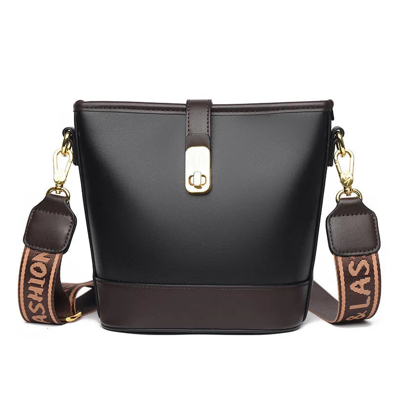 Black PU leather bucket bag with double shoulder straps showing internal compartments and external pocket