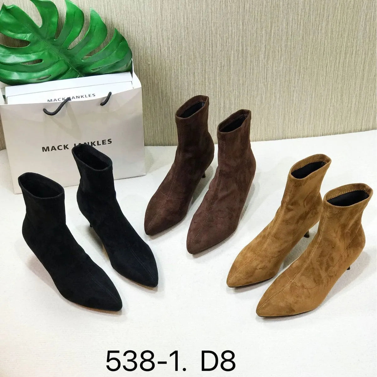 Black pointed toe stiletto heel ankle boots with microfiber upper and mid-calf length