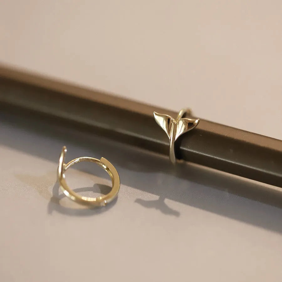 S925 Sterling Silver fishtail drop earrings in gold and white gold tone finishes.