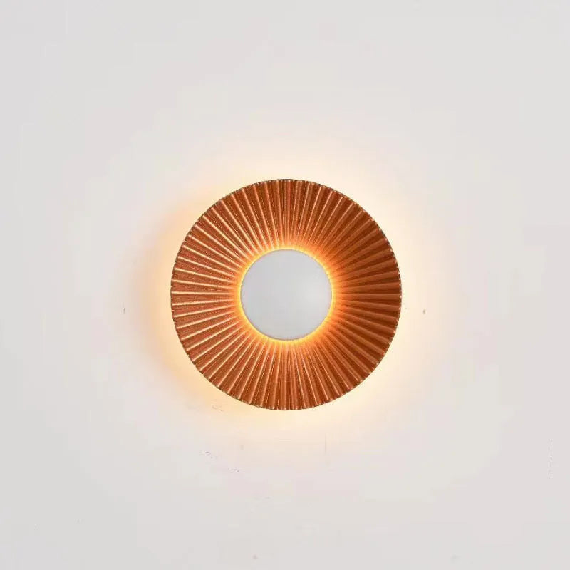 Round aluminium wall lamp with LED light in various colour options including white and gold variants