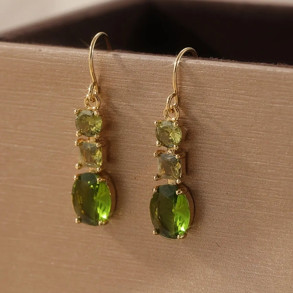 Green geometric quadrilateral copper earrings in a retro Bohemian unisex style.