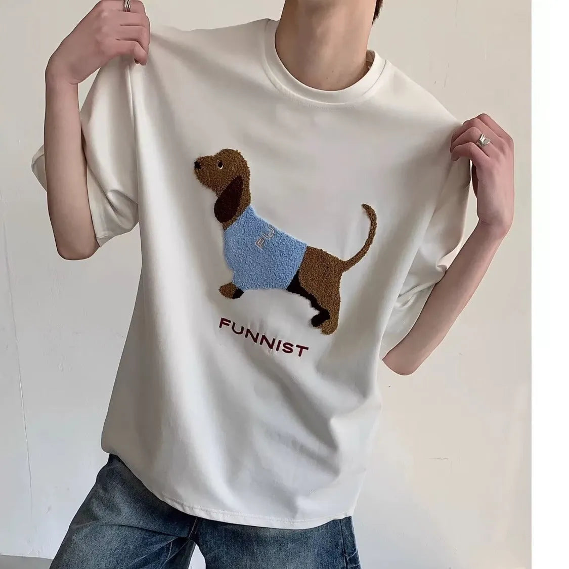 Grey men's round neck T-shirt with an embroidered dachshund dog design on the chest.