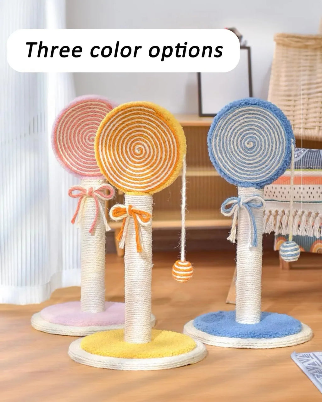 Blue cat scratching post with natural sisal rope and a hanging yellow ball toy on a sturdy wooden base.